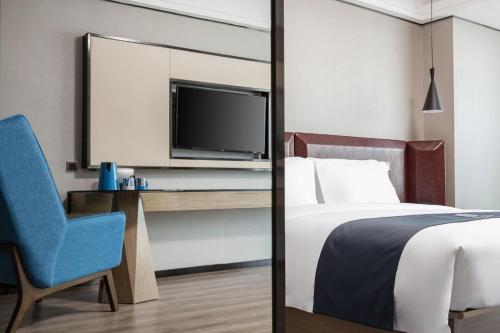 Imagen de la habitación del Hotel Echarm Haikou. Foto 18