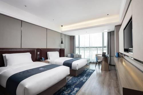 Imagen de la habitación del Hotel Echarm Haikou. Foto 19