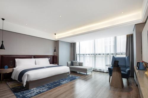 Imagen de la habitación del Hotel Echarm Haikou. Foto 20