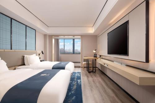 Imagen de la habitación del Hotel Echarm Haikou Friendship Sunshine City Qiaozhong Road Branch. Foto 14