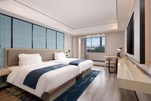 Imagen general del Hotel Echarm Haikou Friendship Sunshine City Qiaozhong Road Branch. Foto 2