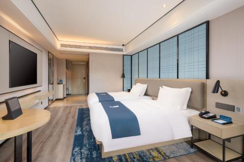 Imagen general del Hotel Echarm Haikou Friendship Sunshine City Qiaozhong Road Branch. Foto 3
