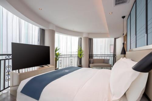 Imagen general del Hotel Echarm Haikou Friendship Sunshine City Qiaozhong Road Branch. Foto 7