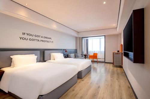 Imagen de la habitación del Hotel Echarm Haikou Friendship Sunshine City Qiaozhong Road Branch. Foto 19