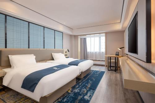 Imagen de la habitación del Hotel Echarm Haikou Friendship Sunshine City Qiaozhong Road Branch. Foto 20