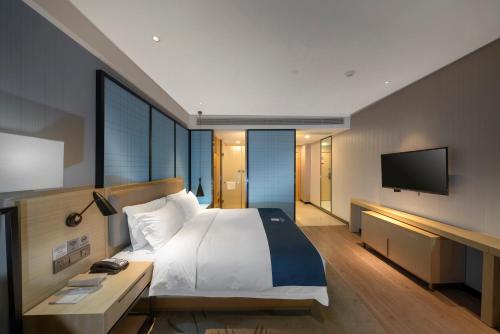 Imagen de la habitación del Hotel Echarm Haikou Zhongshan South Road East High Speed Railway Station. Foto 17