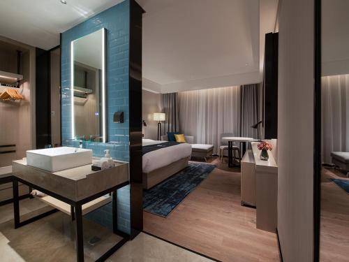 Imagen de la habitación del Hotel Echarm Heyuan Longchuan. Foto 16