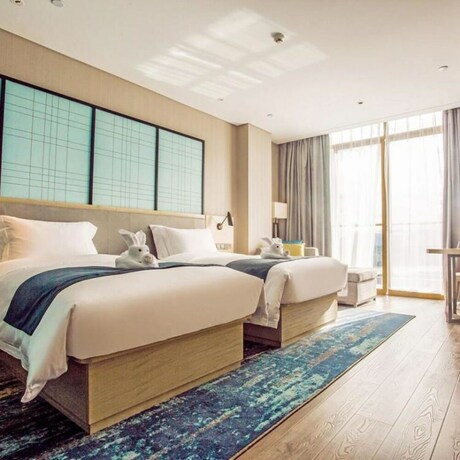 Imagen de la habitación del Hotel Echarm Hotel (Qionghai Wanquan River). Foto 13