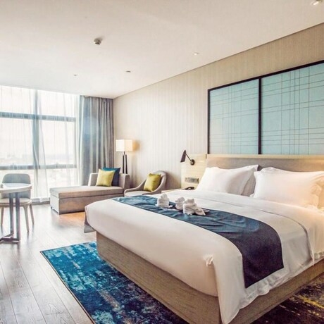Imagen de la habitación del Hotel Echarm Hotel (Qionghai Wanquan River). Foto 17
