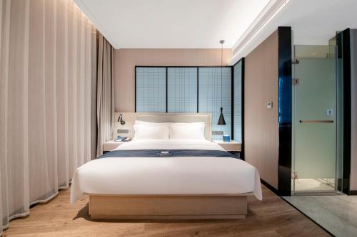 Imagen de la habitación del Hotel Echarm Hotel - Wuhan University Hongshan Square Metro Station. Foto 18