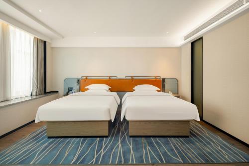 Imagen de la habitación del Hotel Echarm Laibin Financial Investment Building Zhenghe Pedestrian Street Shop. Foto 20