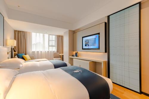 Imagen general del Hotel Echarm Mianyang High-speed Railway Station CapitaLand Plaza. Foto 7