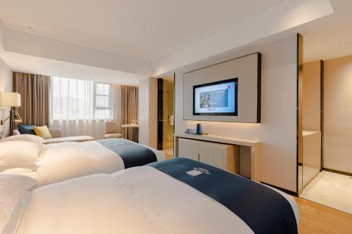 Imagen de la habitación del Hotel Echarm Mianyang High-speed Railway Station CapitaLand Plaza. Foto 16