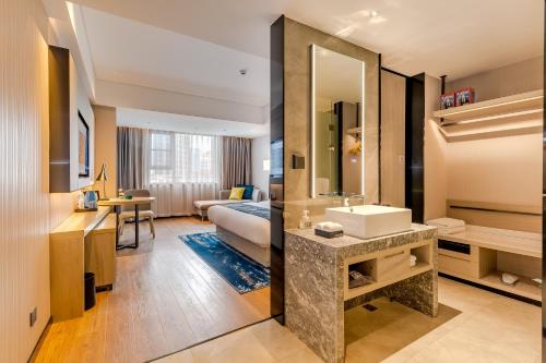 Imagen general del Hotel Echarm Mianyang High-speed Railway Station CapitaLand Plaza. Foto 14