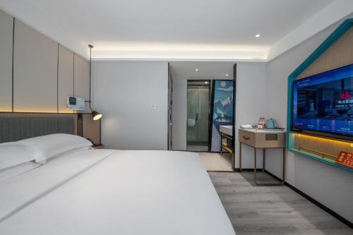 Imagen de la habitación del Hotel Echarm Potala Palace Da Zhao Temple Branch. Foto 18