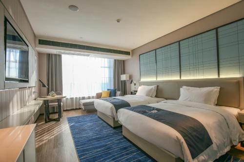 Imagen general del Hotel Echarm Pubei Chengxin Commercial Plaza. Foto 1