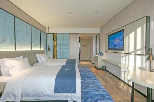 Imagen general del Hotel Echarm Pubei Chengxin Commercial Plaza. Foto 2
