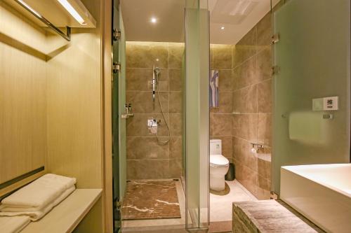 Imagen de la habitación del Hotel Echarm Pubei Chengxin Commercial Plaza. Foto 19