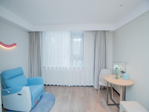 Imagen de la habitación del Hotel Echarm Qingyuan Qingcheng Station Municipal Government Shop. Foto 17