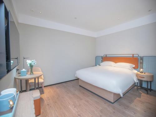 Imagen de la habitación del Hotel Echarm Qingyuan Qingcheng Station Municipal Government Shop. Foto 18