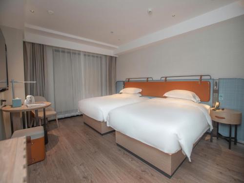 Imagen general del Hotel Echarm Qingyuan Qingcheng Station Municipal Government Shop. Foto 9