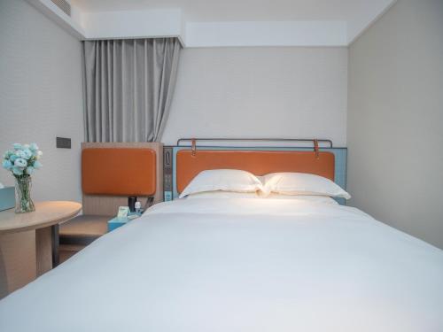 Imagen de la habitación del Hotel Echarm Qingyuan Qingcheng Station Municipal Government Shop. Foto 20