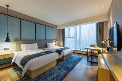 Imagen general del Hotel Echarm Wuhan Hanyang Wangjiawan Sixin Avenue Metro Station. Foto 11