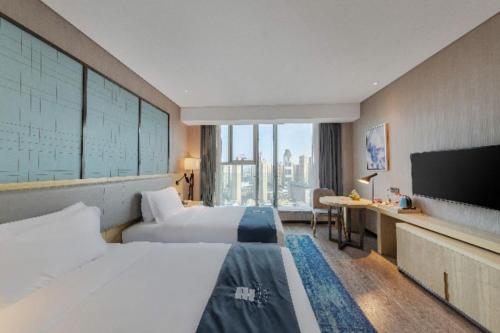 Imagen de la habitación del Hotel Echarm Wuhan Hanyang Wangjiawan Sixin Avenue Metro Station. Foto 17
