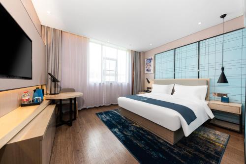 Imagen de la habitación del Hotel Echarm Wuhan Jiefang Park Zhaojiajiao Metro Station. Foto 14