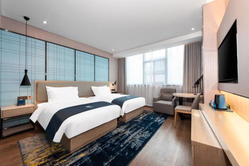 Imagen de la habitación del Hotel Echarm Wuhan Jiefang Park Zhaojiajiao Metro Station. Foto 15