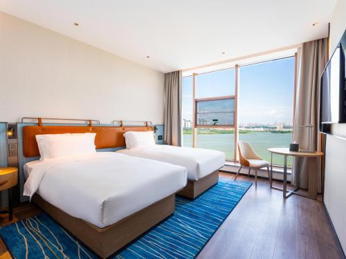 Imagen de la habitación del Hotel Echarm - Wuhan Jingkai Yongwang Sports Center. Foto 13