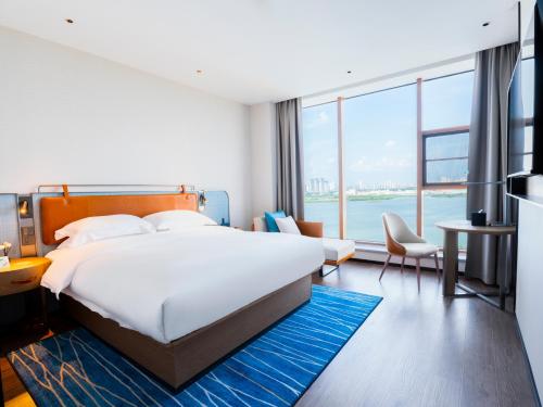 Imagen de la habitación del Hotel Echarm - Wuhan Jingkai Yongwang Sports Center. Foto 14