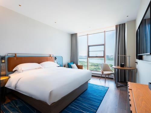 Imagen de la habitación del Hotel Echarm - Wuhan Jingkai Yongwang Sports Center. Foto 15