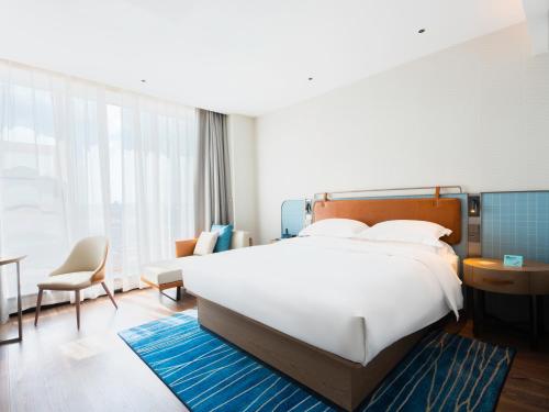 Imagen de la habitación del Hotel Echarm - Wuhan Jingkai Yongwang Sports Center. Foto 16