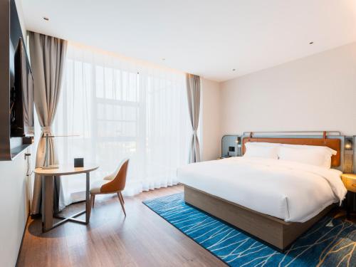 Imagen de la habitación del Hotel Echarm - Wuhan Jingkai Yongwang Sports Center. Foto 17