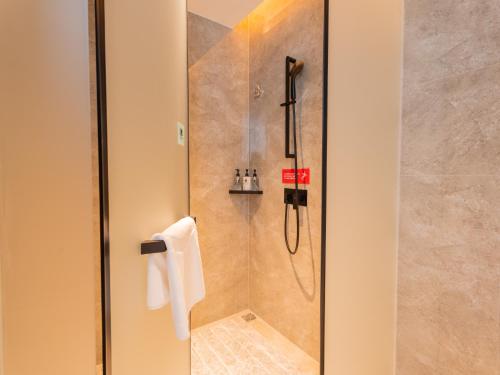 Imagen de la habitación del Hotel Echarm - Wuhan Jingkai Yongwang Sports Center. Foto 18