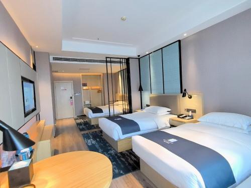 Imagen de la habitación del Hotel Echarm - Xi\'an West 2nd Ring Road Taio Plaza. Foto 15