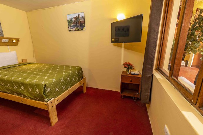 Imagen de la habitación del Hotel Eco Inn. Foto 15