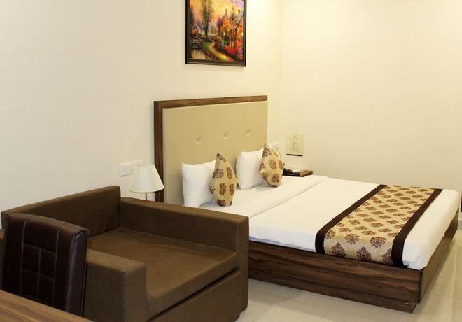 Imagen de la habitación del Hotel Eco Inn, Jamnagar. Foto 13