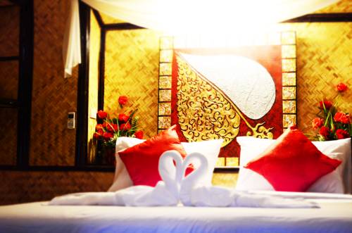 Imagen de la habitación del Hotel Eco Lanta Hideaway Beach Resort. Foto 7