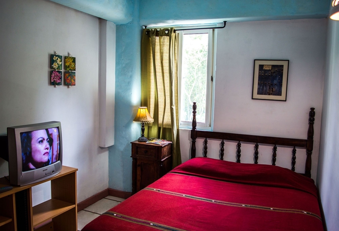 Imagen de la habitación del Hotel Eco Suites Uxlabil Guatemala City. Foto 4