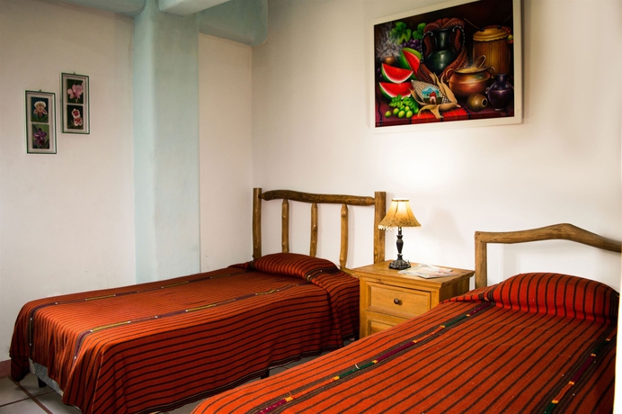 Imagen de la habitación del Hotel Eco Suites Uxlabil Guatemala City. Foto 5