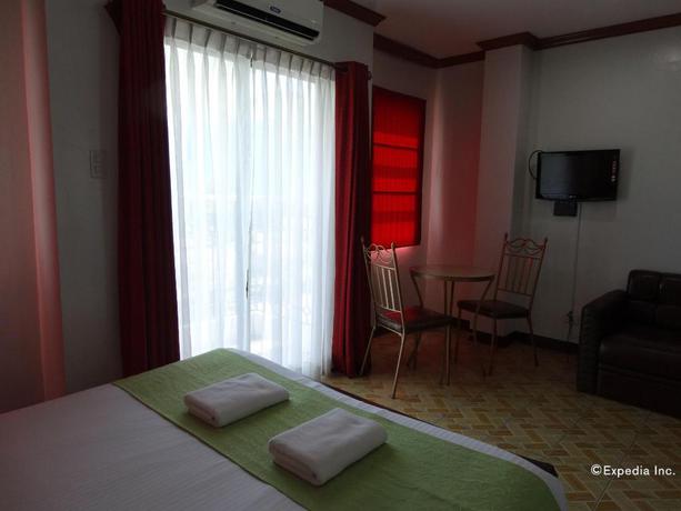 Imagen de la habitación del Hotel Ecoland Suites. Foto 19