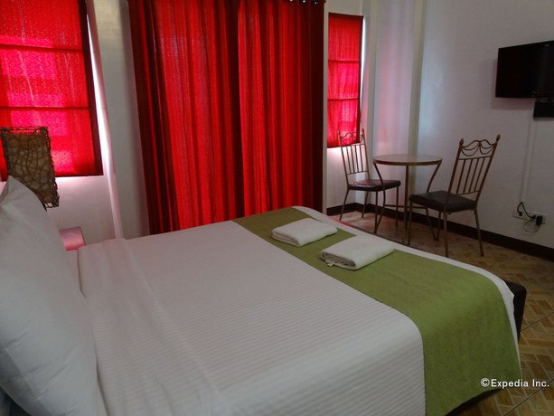 Imagen de la habitación del Hotel Ecoland Suites and Inn. Foto 16