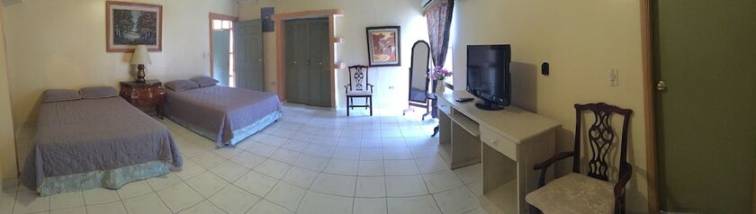 Imagen de la habitación del Hotel Econo Guest House. Foto 17
