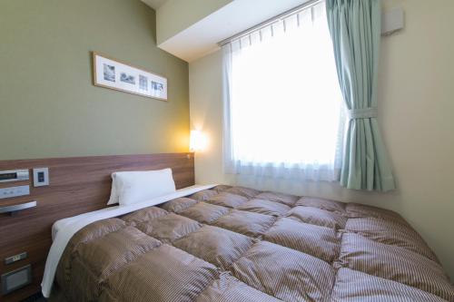 Imagen de la habitación del Hotel Econo Kameyama. Foto 5
