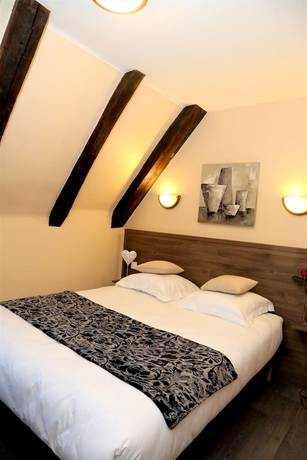 Imagen de la habitación del Hotel Ecu De France. Foto 2