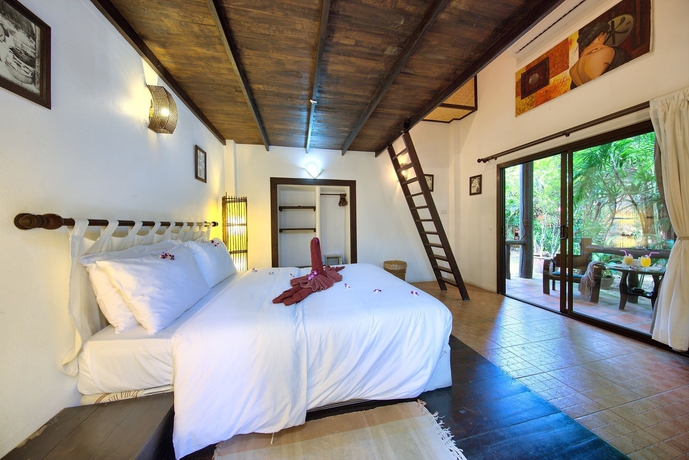 Imagen de la habitación del Hotel Eden Bungalows. Foto 7