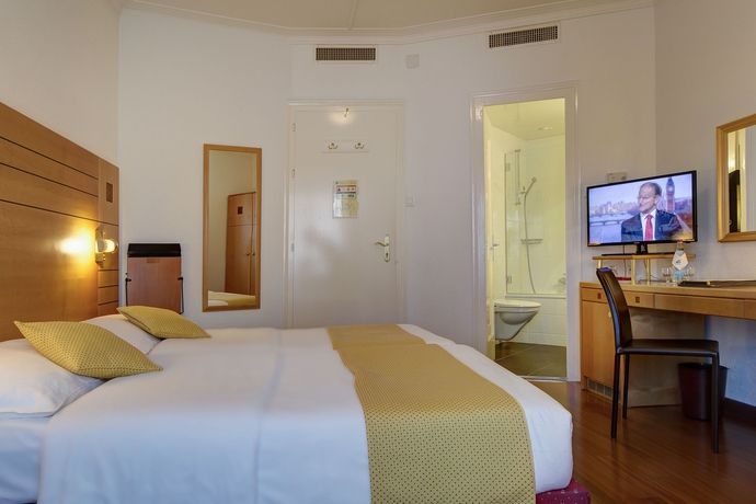 Imagen de la habitación del Hotel Eden Genève. Foto 9
