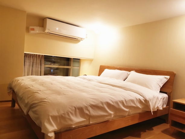 Imagen de la habitación del Hotel Efc Qingchengli Loft Apartment. Foto 9